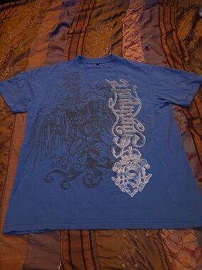 Blue Short-Sleeve Graphic Tee with Ornate Crest